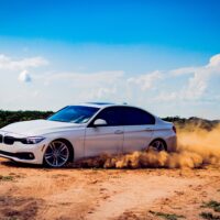 A BMW car drifting in the dirt on the off road